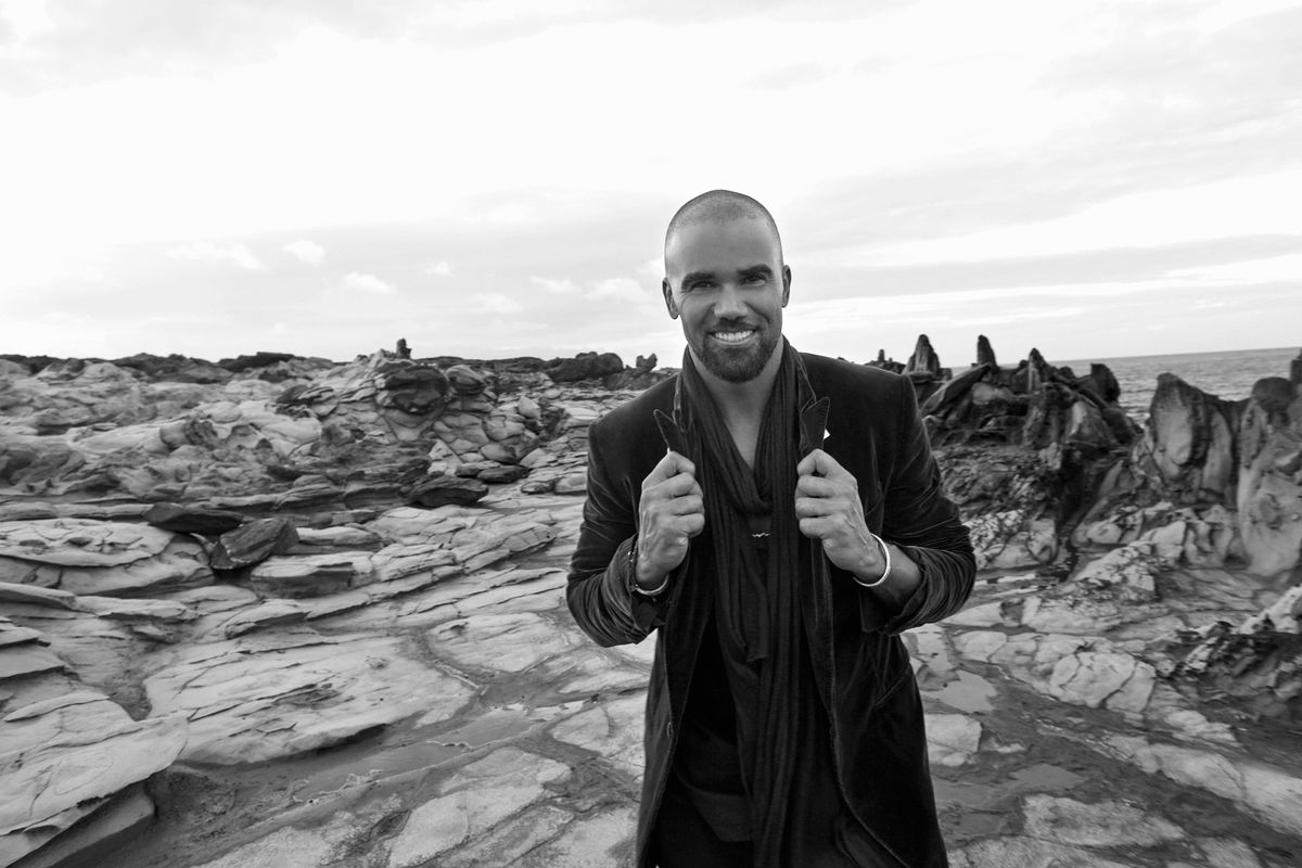Shemar Moore in front of rocky terrain