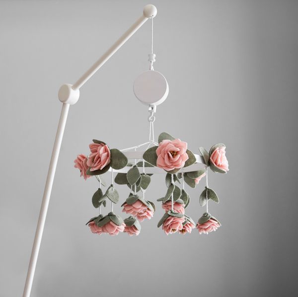Felt rose musical mobile for a crib