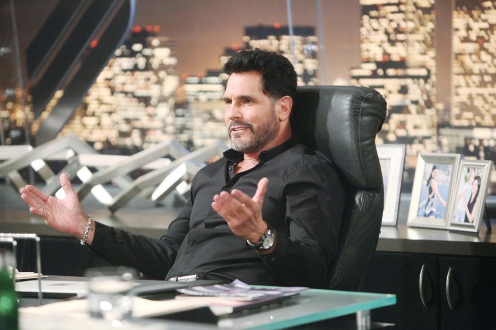 Don Diamont sitting at his office desk on the set of The Bold and the Beautiful.