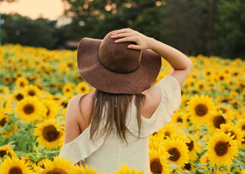 https://www.pexels.com/photo/photo-of-woman-in-a-sunflower-field-906002/