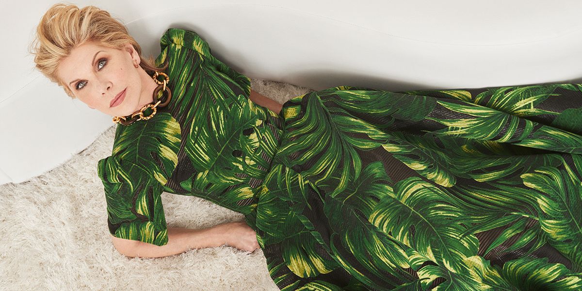 Christine Baranski in a green palm leaf print dress.
