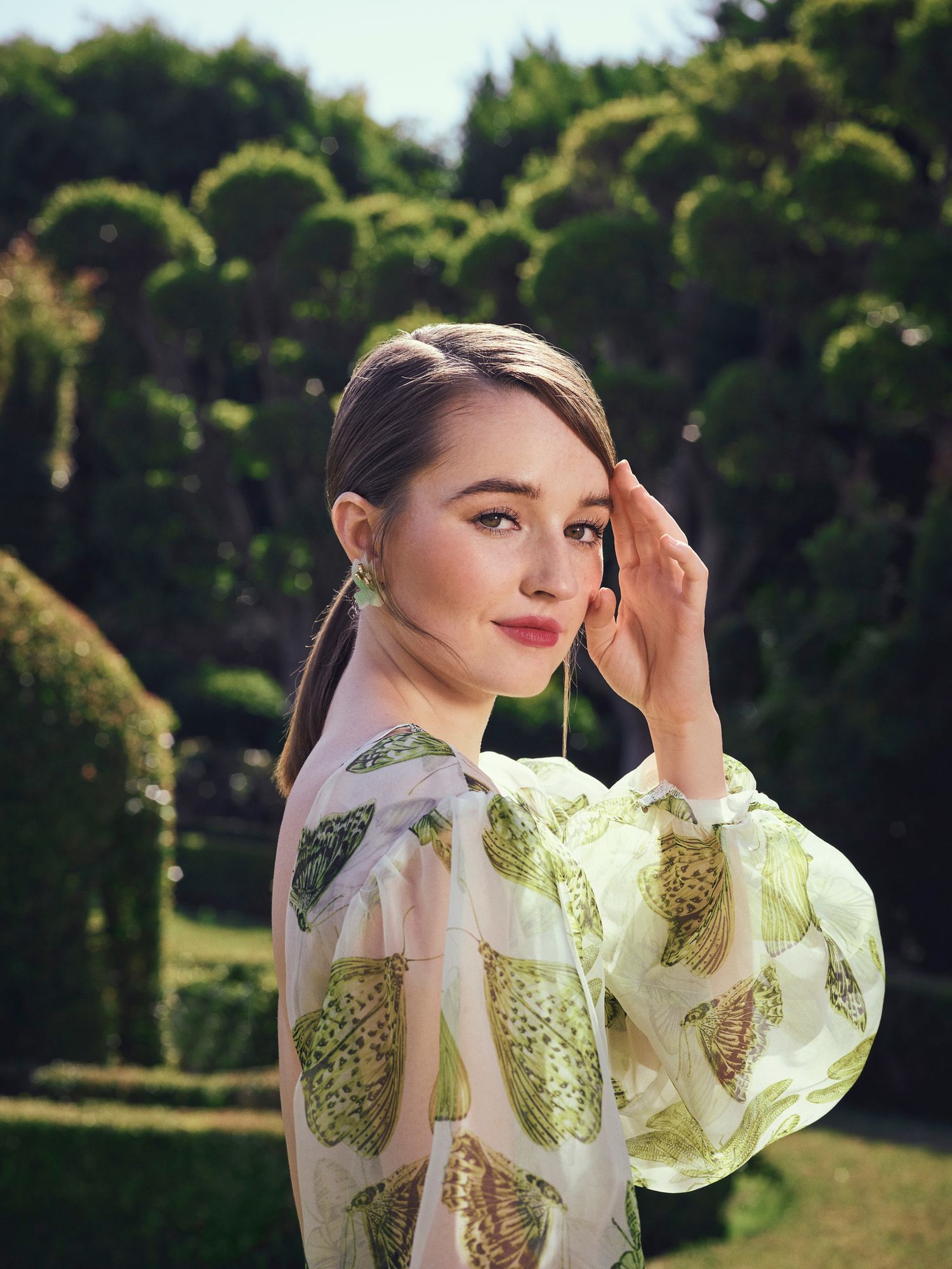 Kaitlyn Dever in butterfly print dress.