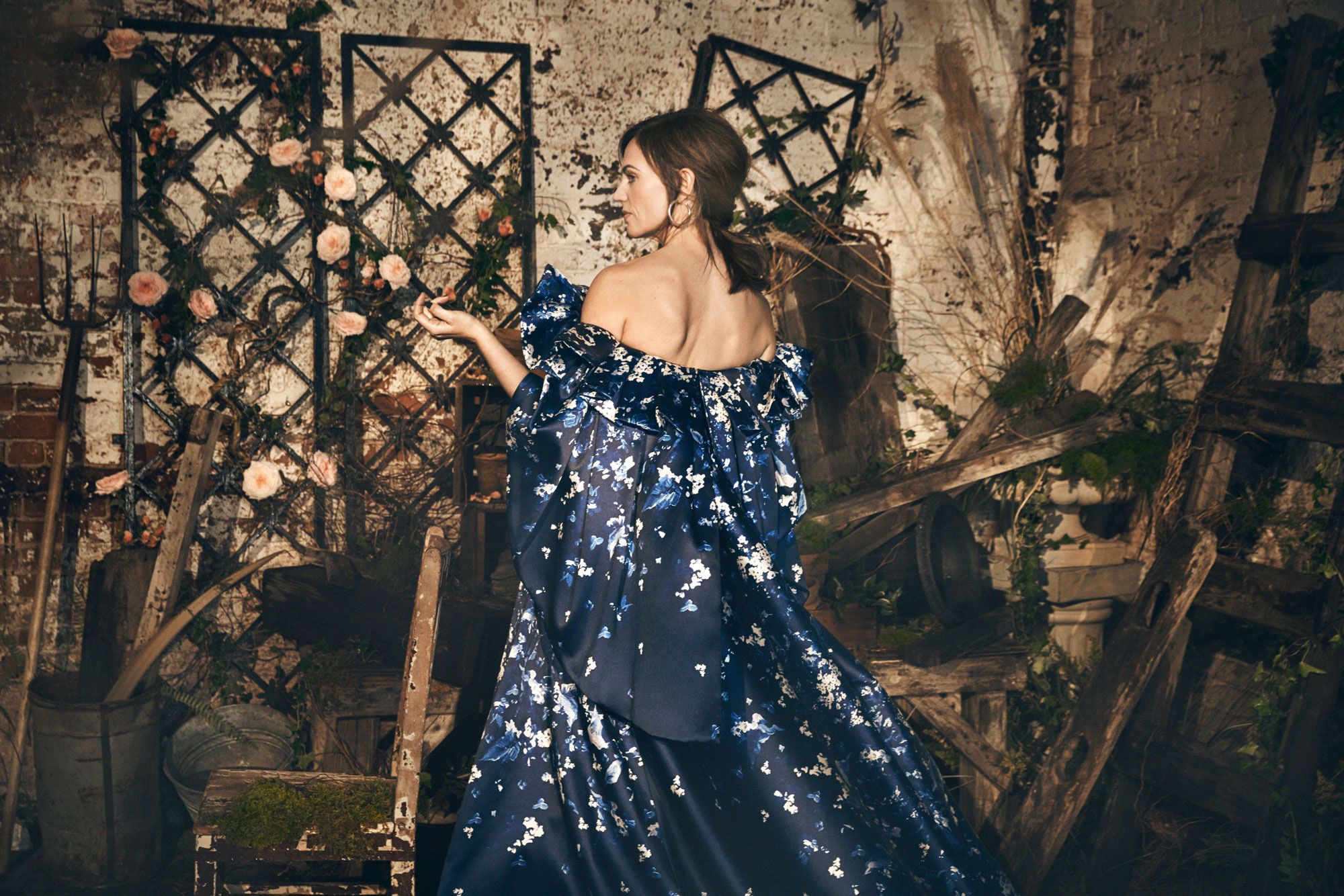 Maggie Siff in a royal blue gown embellished with a floral pattern.
