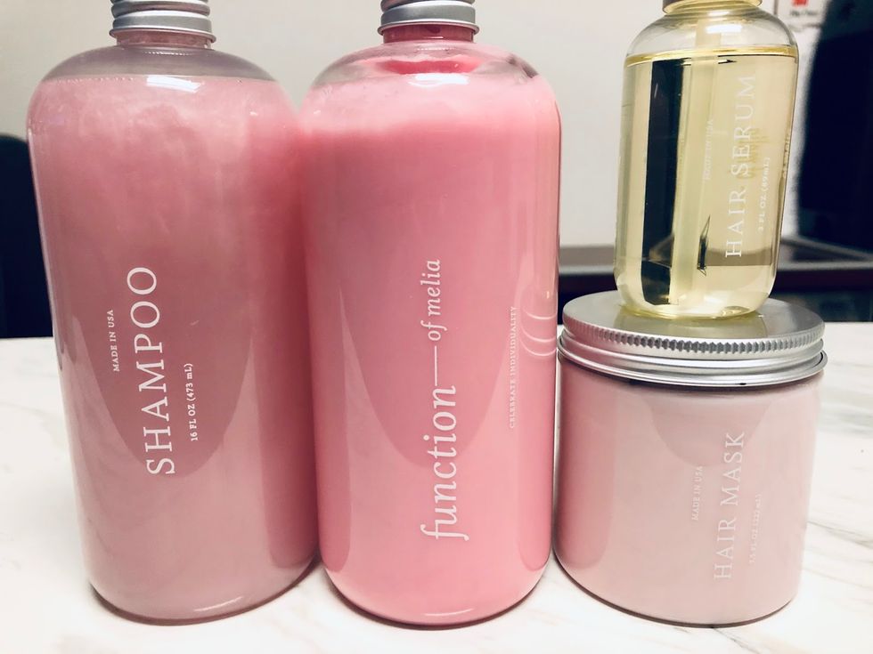 Pink Function Of Beauty Shapoo Bottle