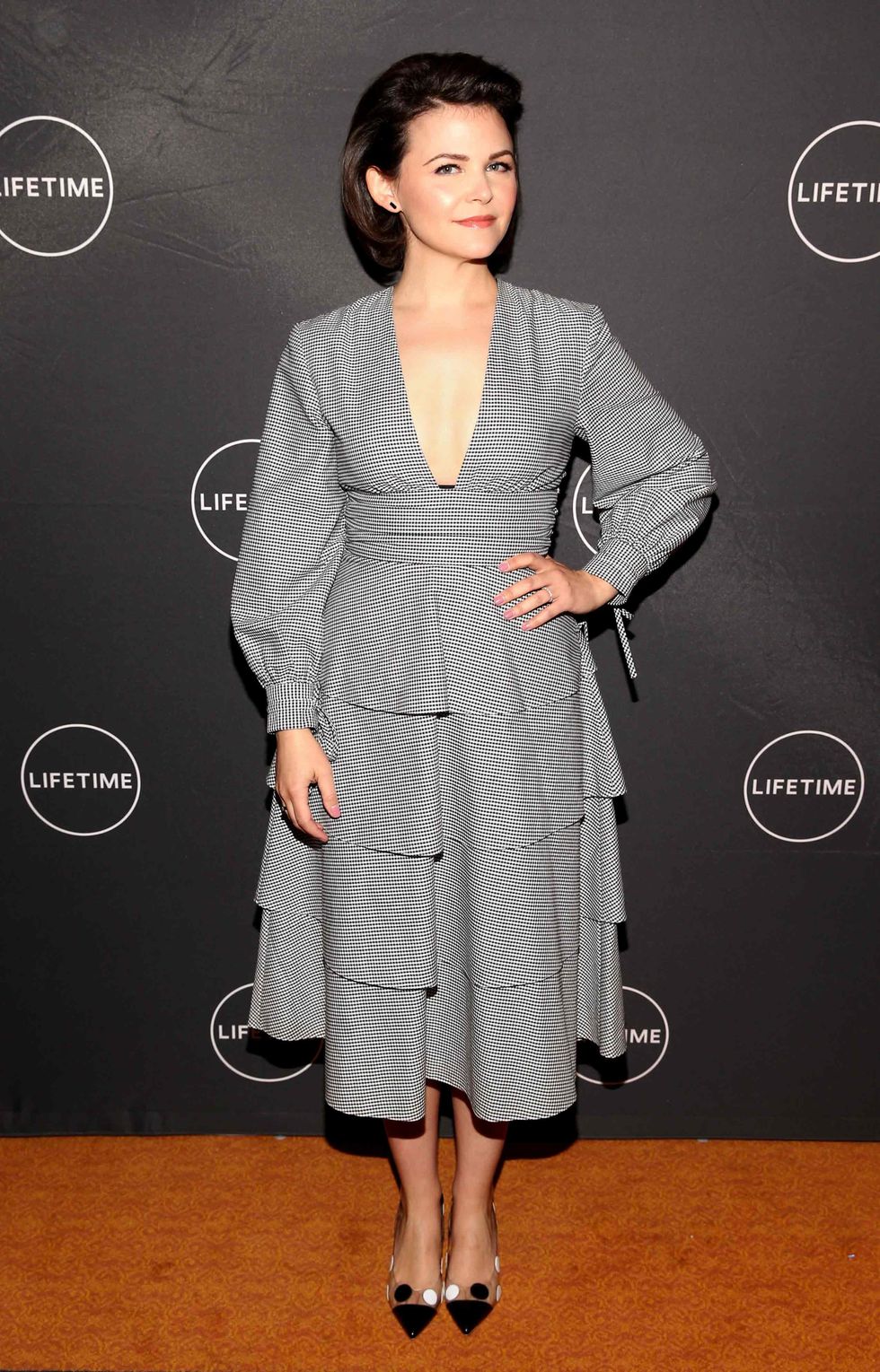 Ginnifer Goodwin in a gray designer dress.