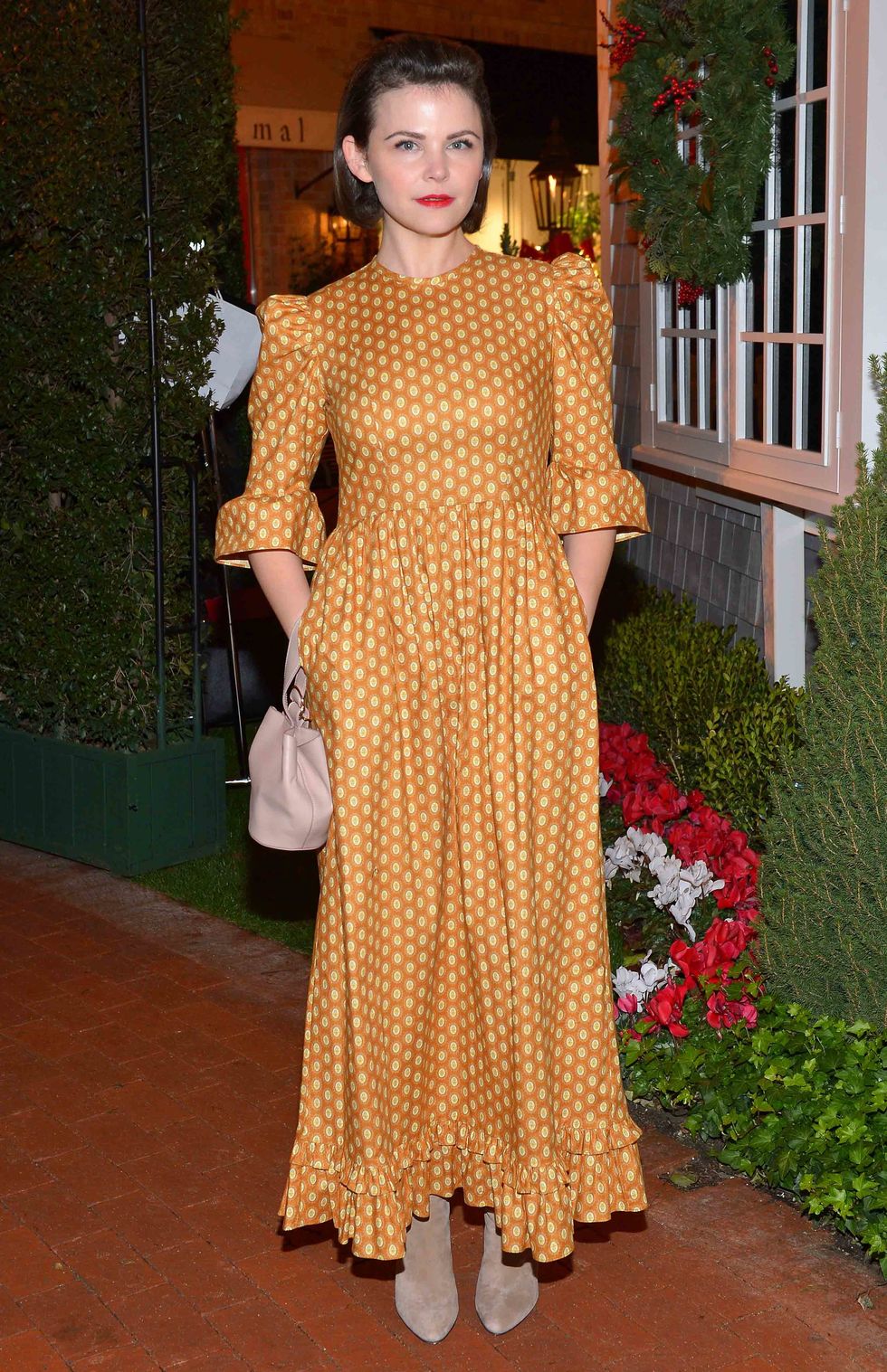Ginnifer Goodwin in a mustard yellow dress.