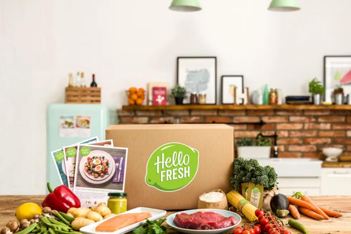 HelloFresh box on a counter with ingredients around it