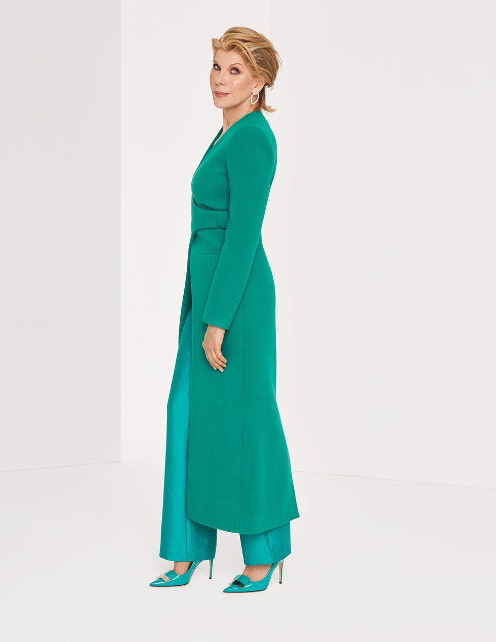 Christine Baranski in a green power suit.