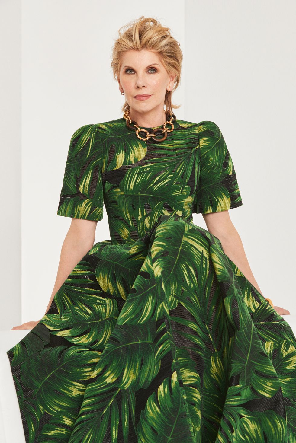 Christine Baranski in a palm leaf print gown.