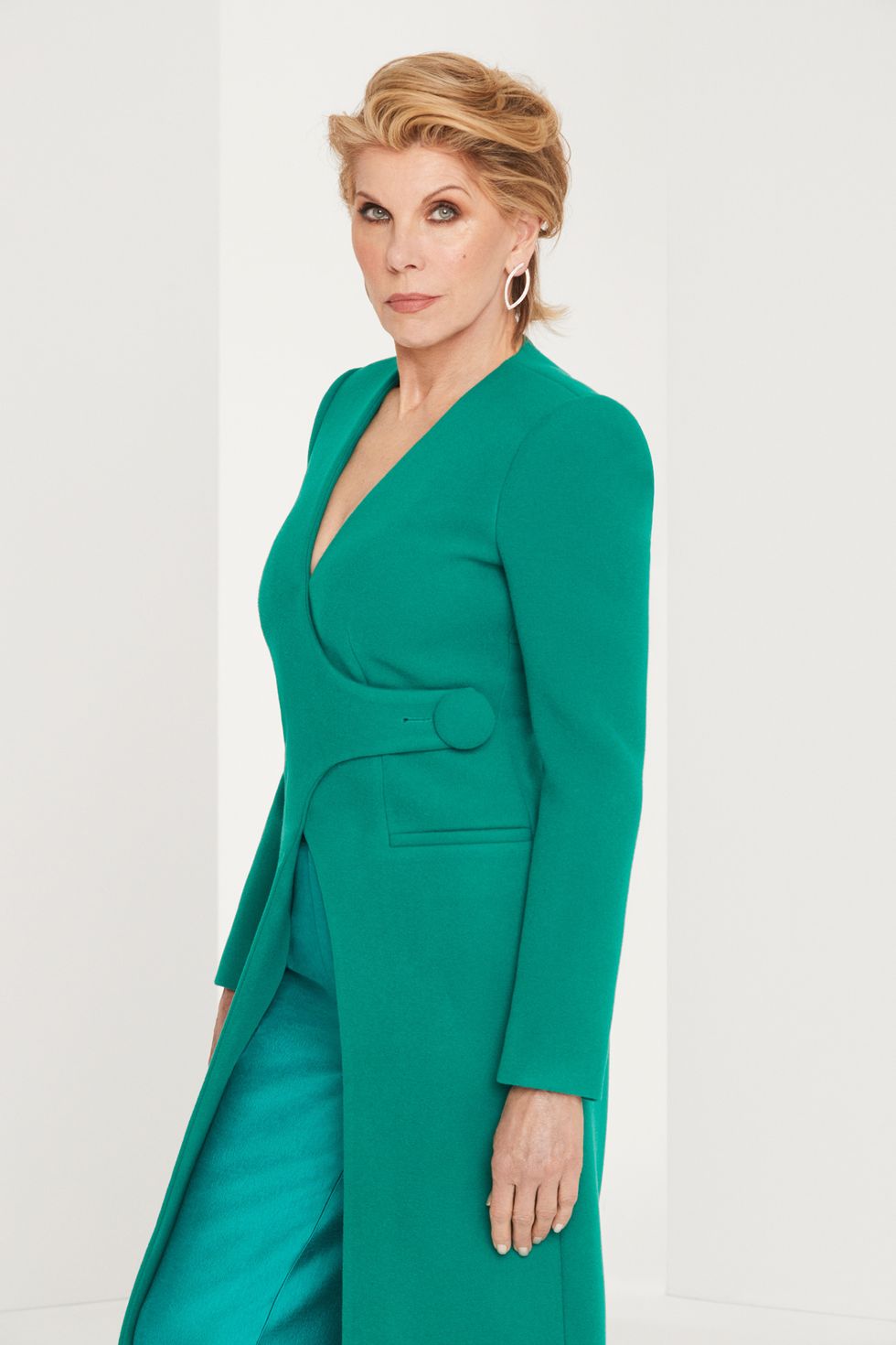 Christine Baranski in a green power suit.