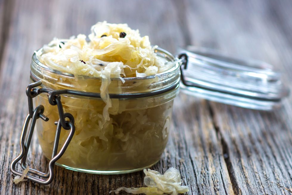A glass jar full of sauerkraut