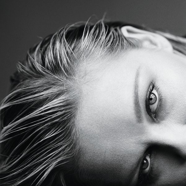 A closeup black and white photo of Kirsten Dunst's eyes.