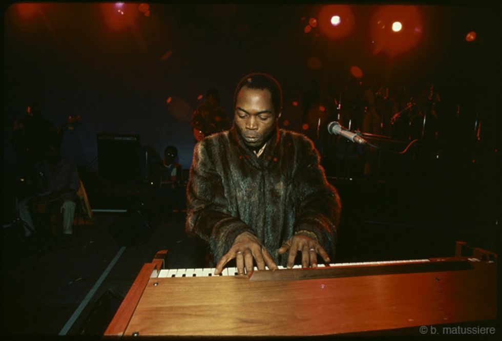 Fela Kuti at a piano