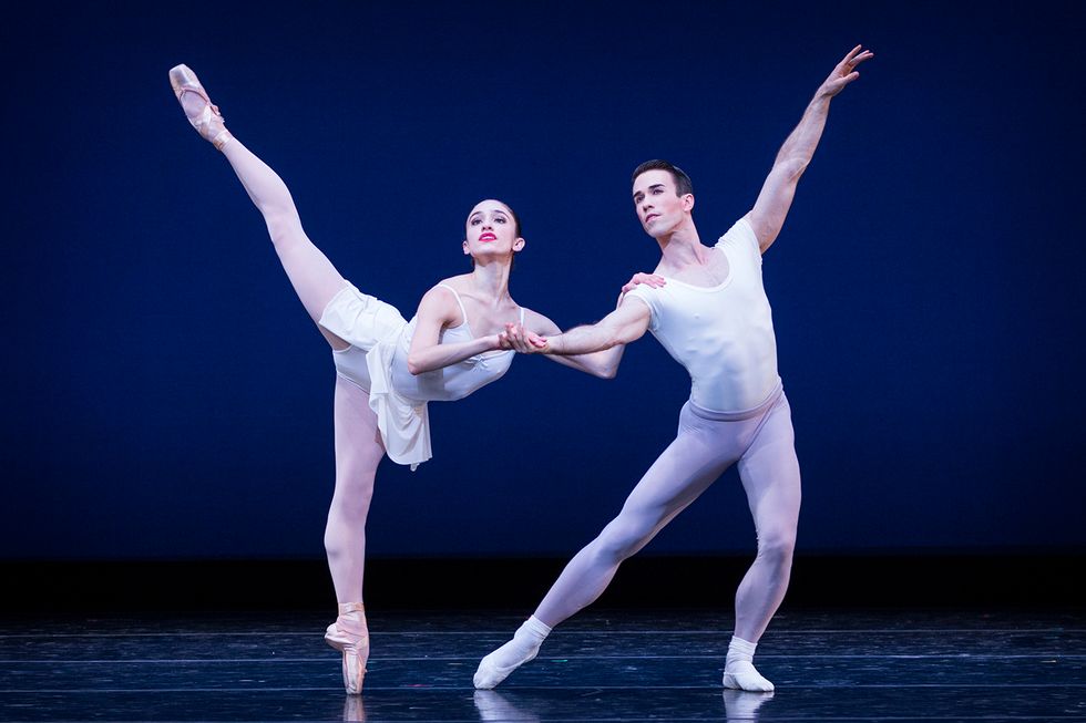 Leta BIasucci, in pench\u00e9, holds on to Benjamin Griffiths right hand and arm for balance as he lunges slightly to the side.