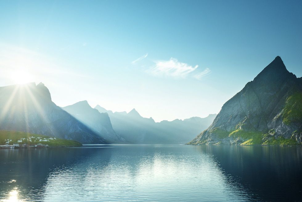 A location with mountains and a lake