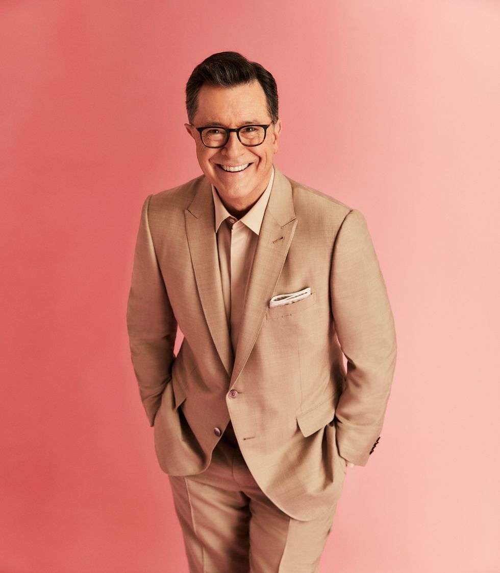 Stephen Colbert in a tan suit.