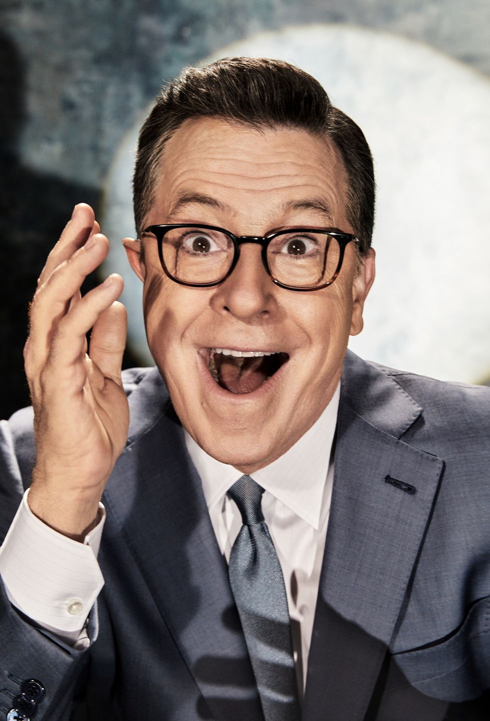 Close-up portrait of Stephen Colbert making expressive face.