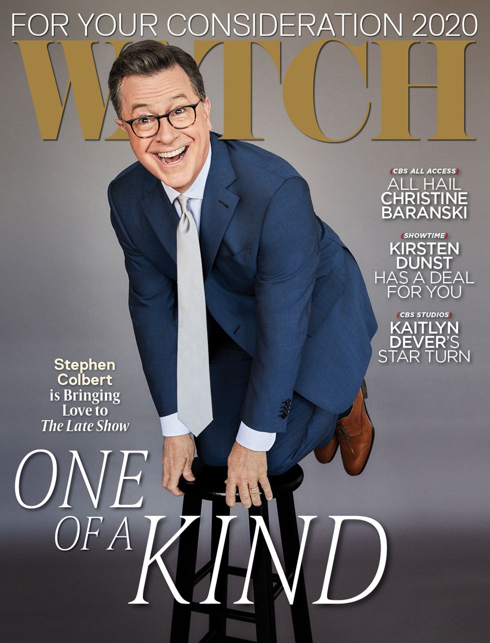 Stephen Colbert in a blue suit kneeling on a stool for a magazine cover.