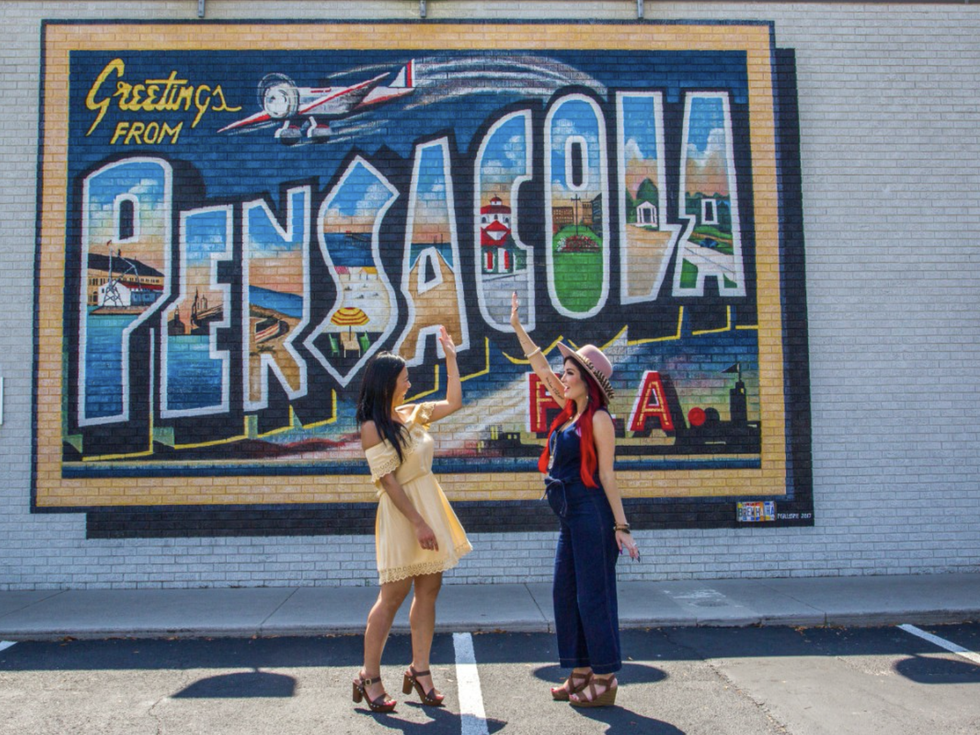 Friends in front of Pensacola Mural