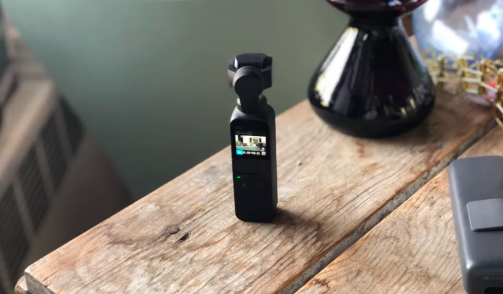 The DJI Osmo Pocket, pictured here, is a tiny video camera that can also shoot time\u00a0lapse videos