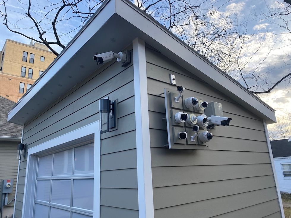 Photo of Alarm.com garage with multiple security cameras and other smart devices.