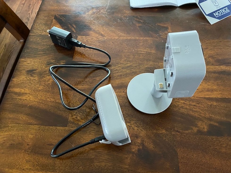 Blue by ADT outdoor camera with battery and charge cord.