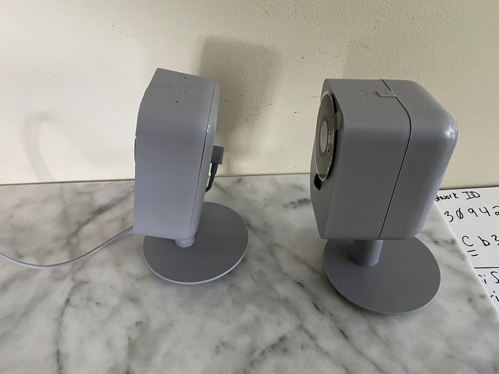 blue by ADT cameras on a countertop.