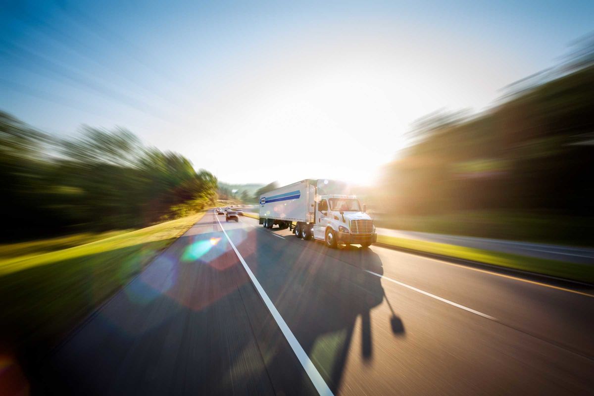 penske tractor and trailer on highway