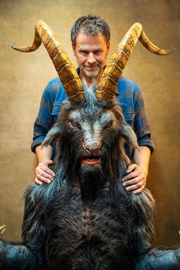 Makeup and effects artist Joel Harlow with a Devil creature.