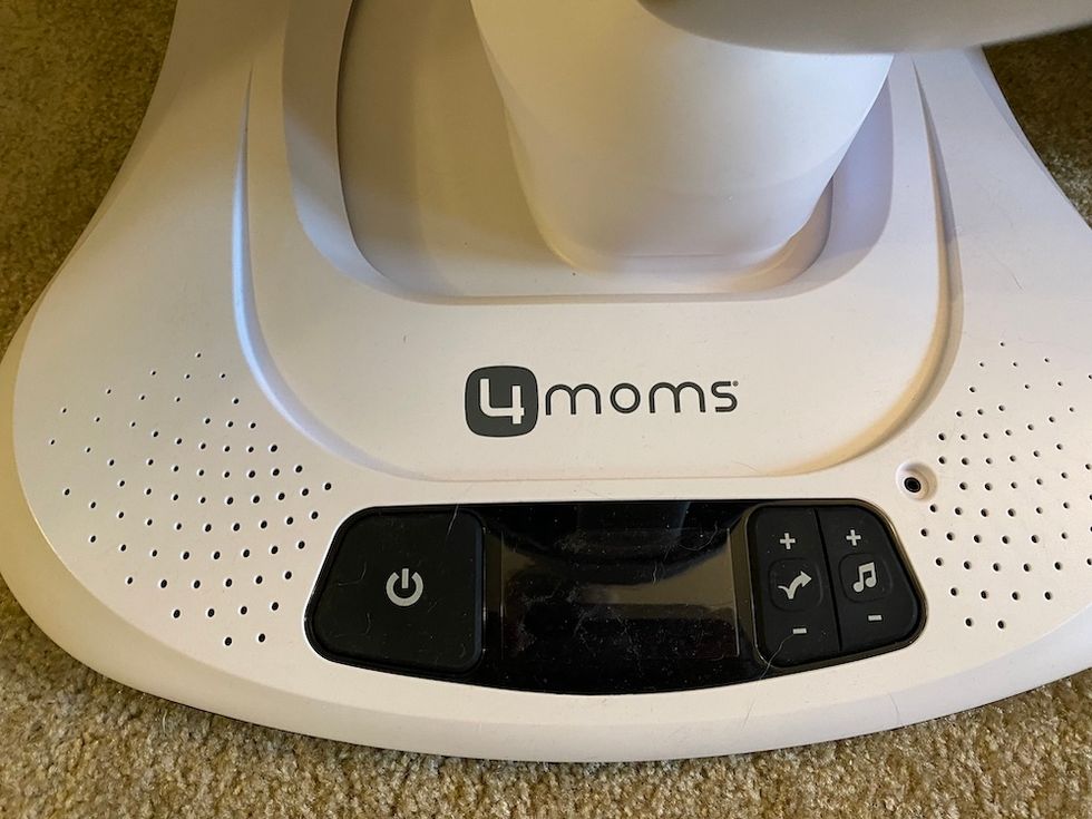 Photo of base of mamaRoo4 with plug for MP3 player.