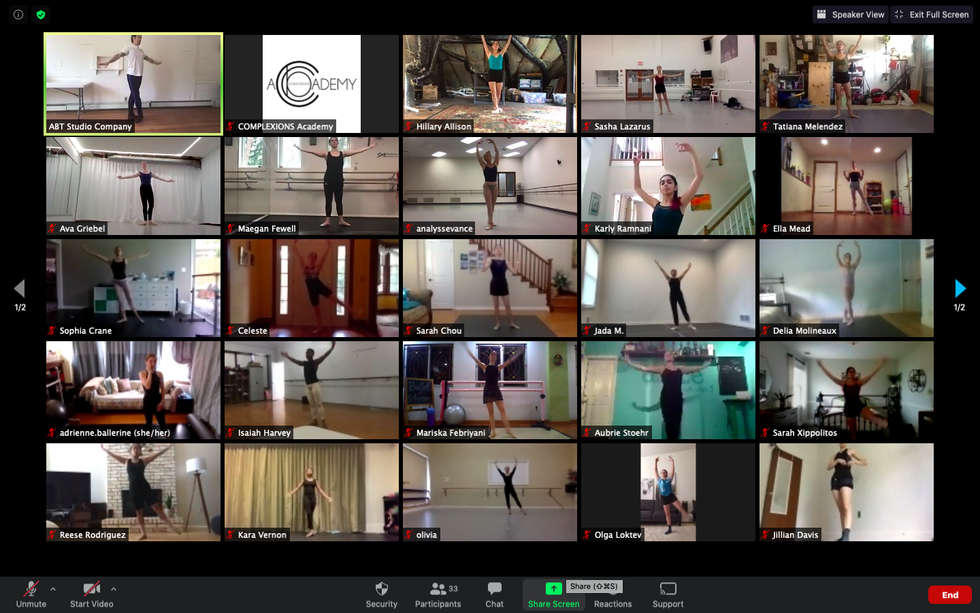 A computer screen shows a ballet class happening on Zoom, with 25 squares showing various dancers taking class in their homes.