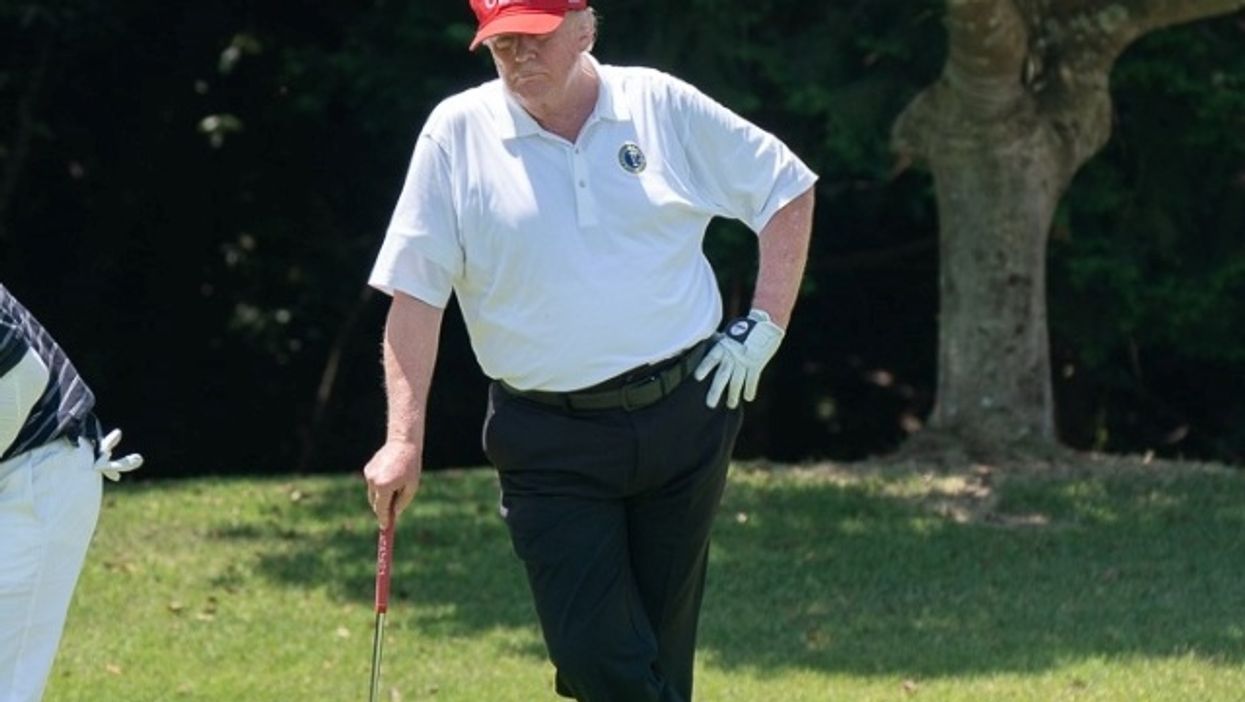 President Donald Trump golfing.