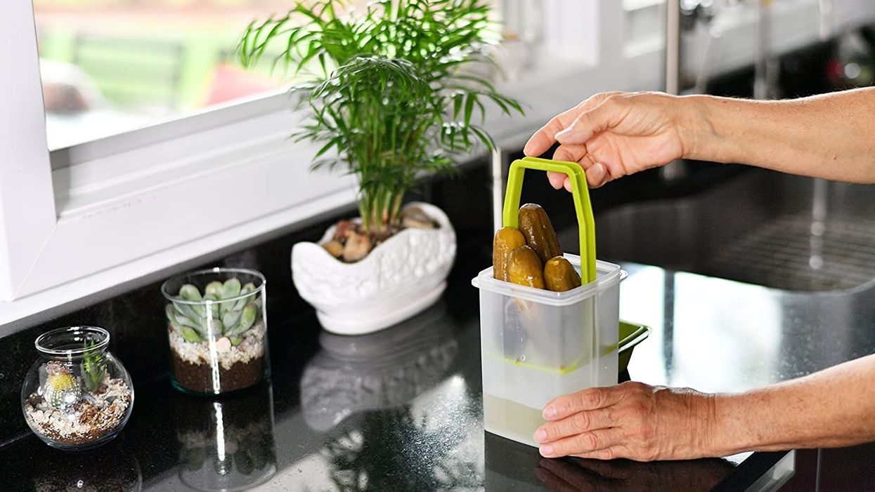 This pickle storage container has a built-in strainer for quick, mess-free snacking