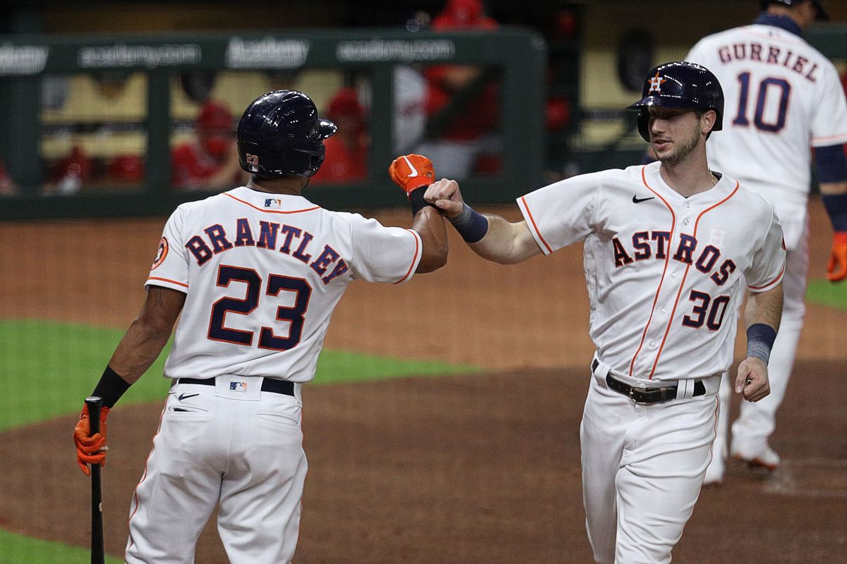 Kyle Tucker and Michael Brantley of the Astros celebrating