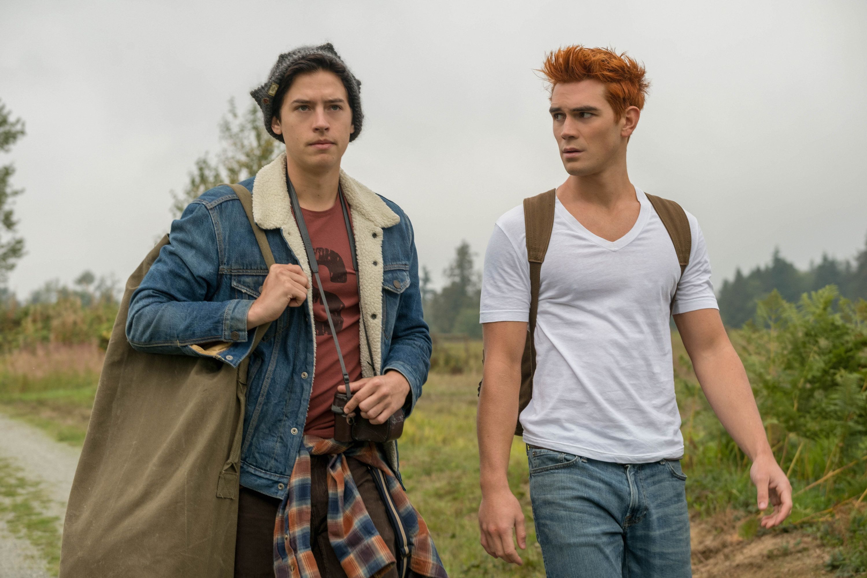 Jughead and Archie walking down a road