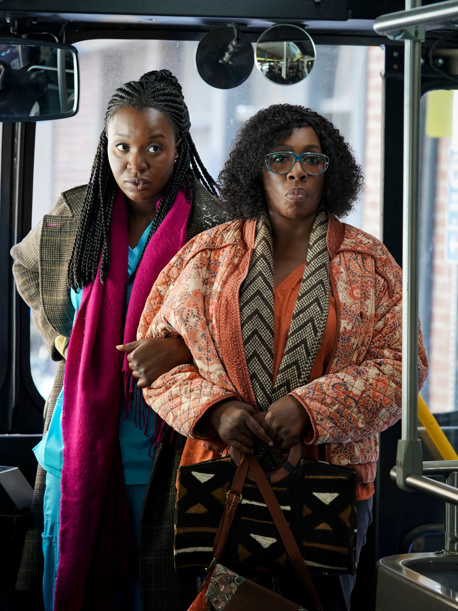 Abishola and Kemi boarding a bus