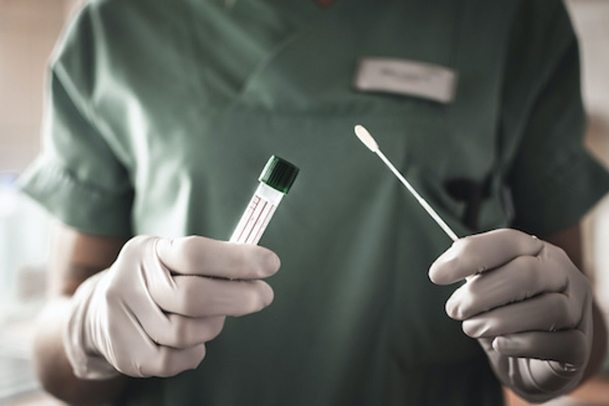 nurse holds a swab for the coronavirus / covid19 test