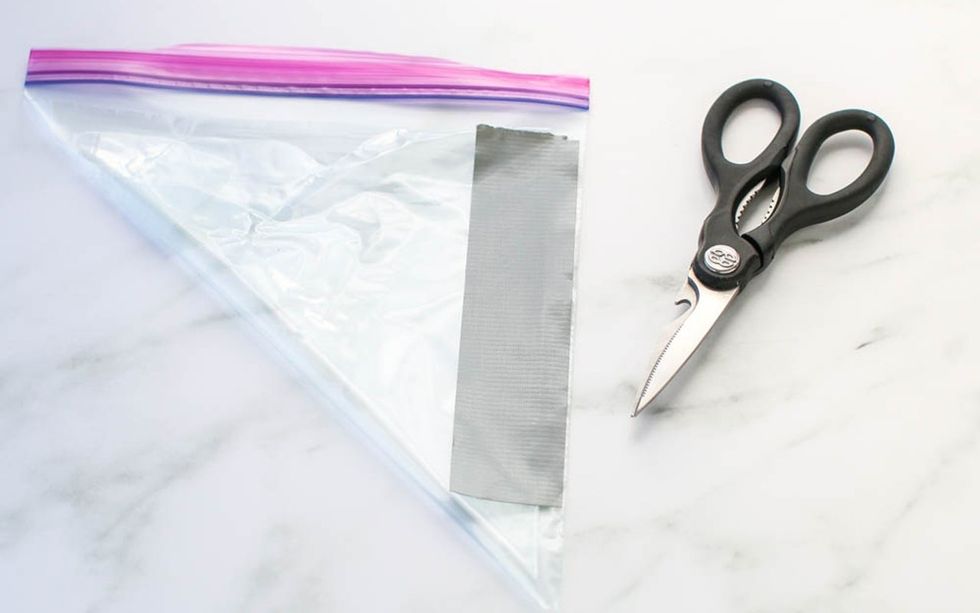 Ziploc Bag And Scissors On A Table