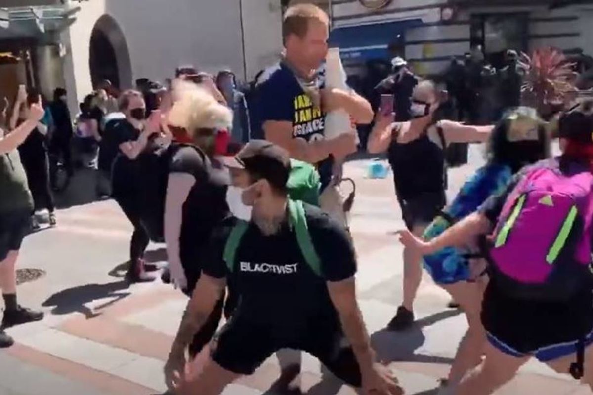 Seattle protesters show the best way to non-violently shut up a notorious street preacher