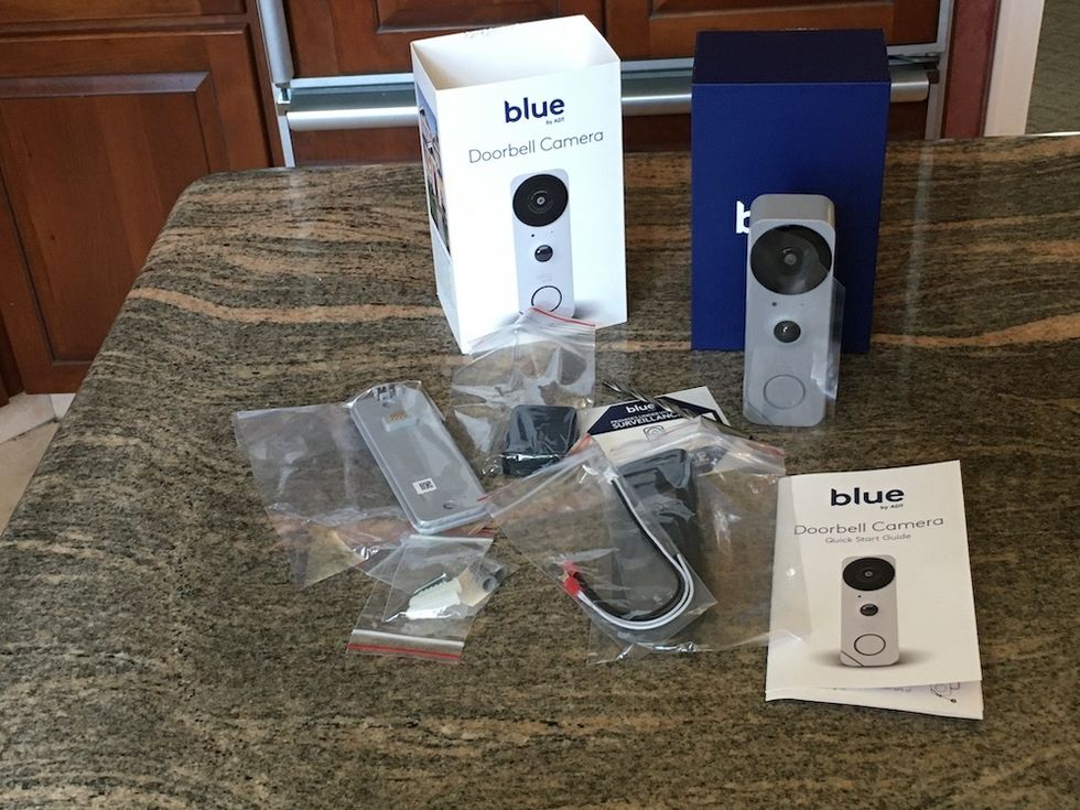 Blue Doorbell Camera unboxed on a counter
