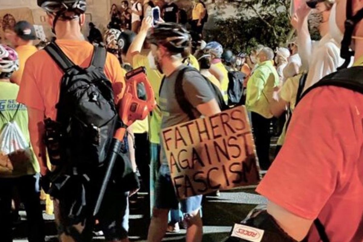 Dads with leaf blowers join 'Wall of Moms' in Portland protests