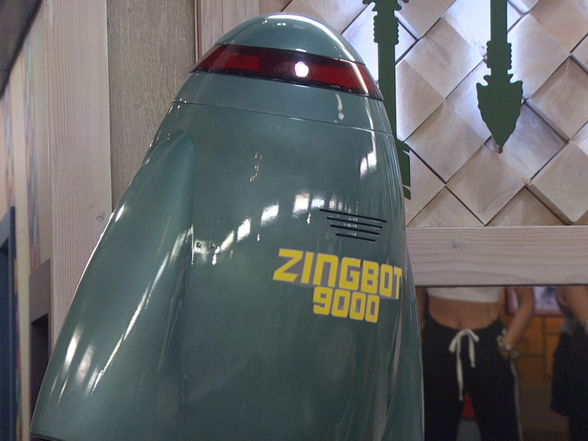 The shiny robotlike Zinbgot 9000 programmed to give Houseguests insulting one liners