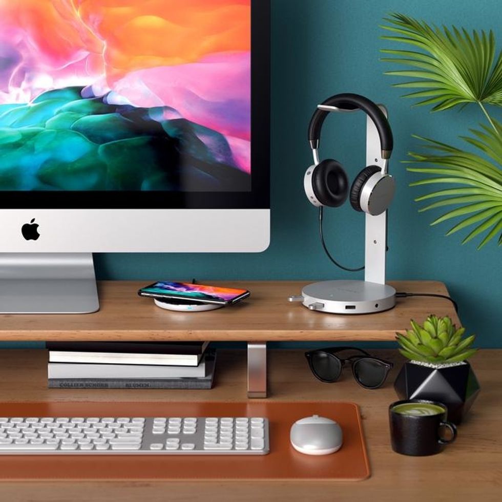a photo of a desk with Satechi 2-in-1 Headphone Stand with Wireless Charger 