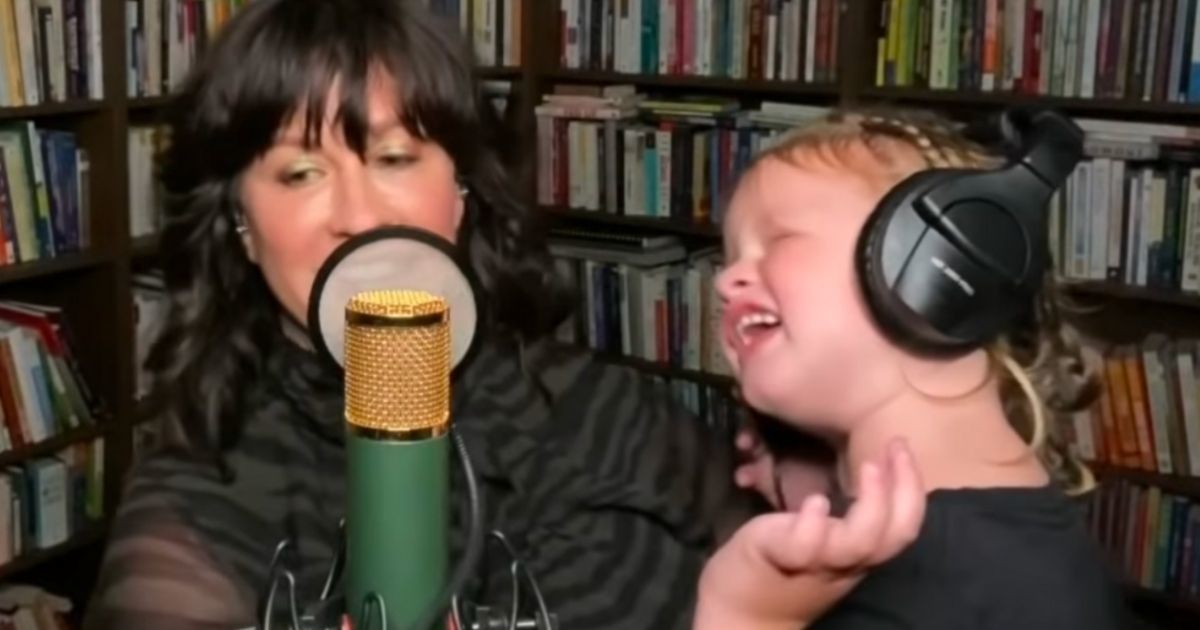 Alanis Morissette tries to debut her new song but her daughter keeps adorably interrupting