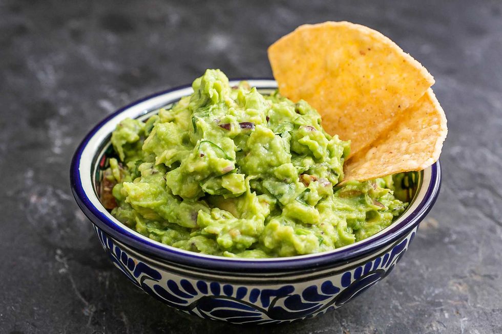 Guacamole In A Bowl With Tortilla Chips