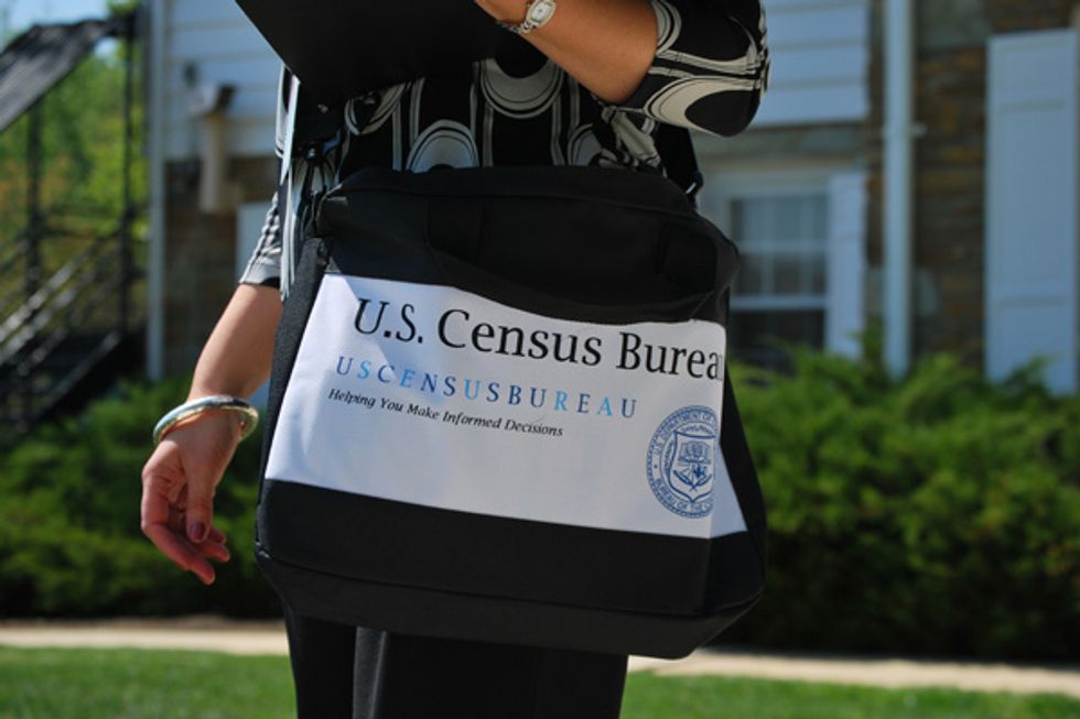 Photo of a Census Bureau employee with official Census Bureau bag