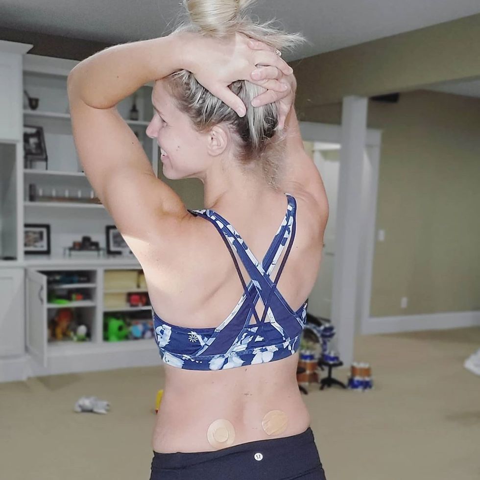 Woman in workout clothes with 2 CBD patches on her back