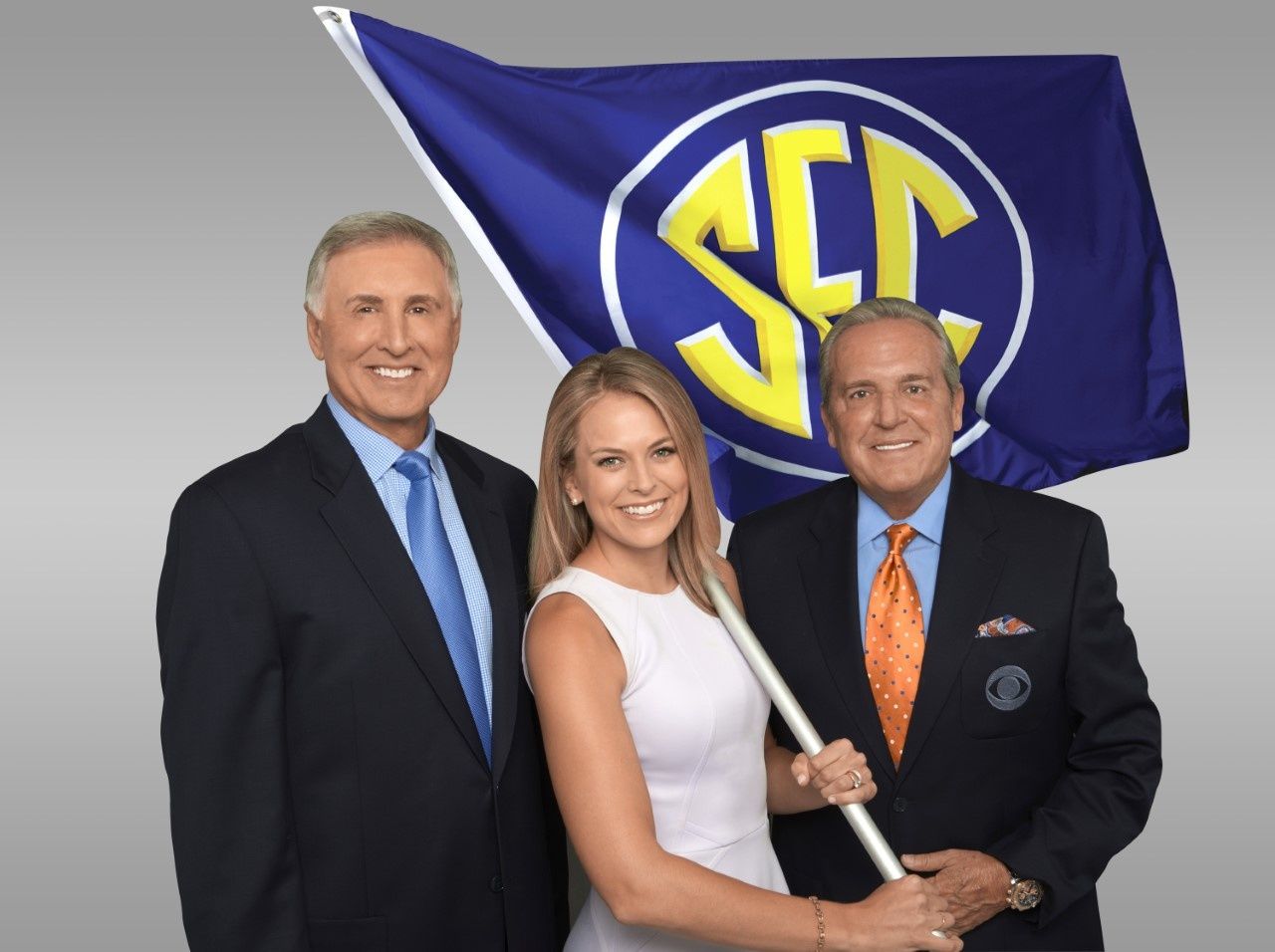Gary Danielson Jamie Erdahl and Brad Nessler holding the SEC flag