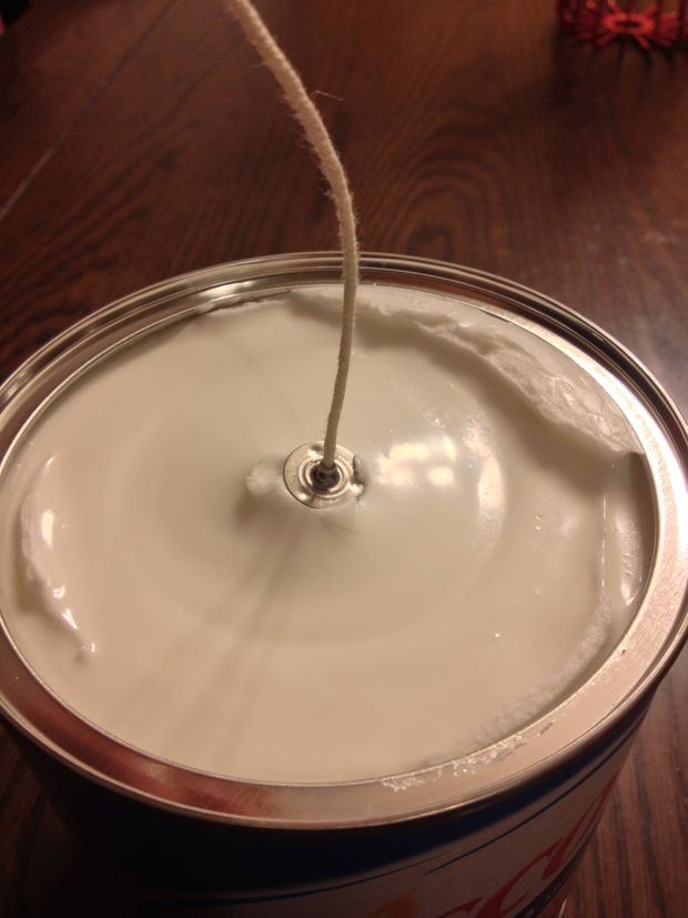 Place your wick on top of the hole. The good thing about pre-made wicks like this is the metal piece. You can use a standard wick / string, but the metal piece makes it a bit easier to push in.