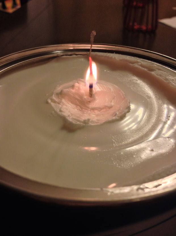 The top part will burn off in a few seconds. Once the fire hits the Crisco, it will start acting like a normal candle.